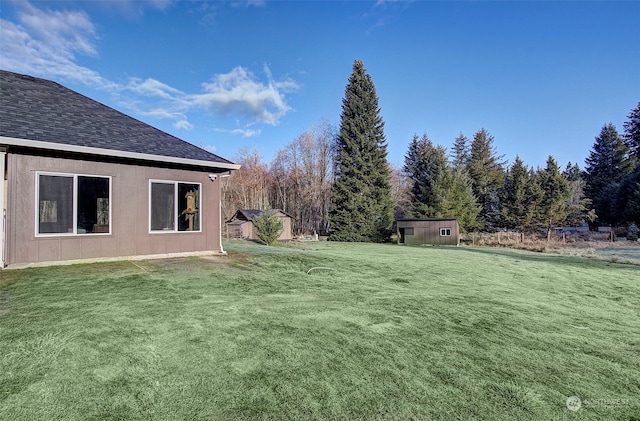 view of yard with a storage shed