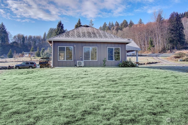 rear view of house with a yard