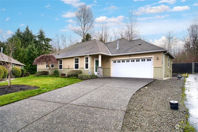 ranch-style home with a garage and a front yard