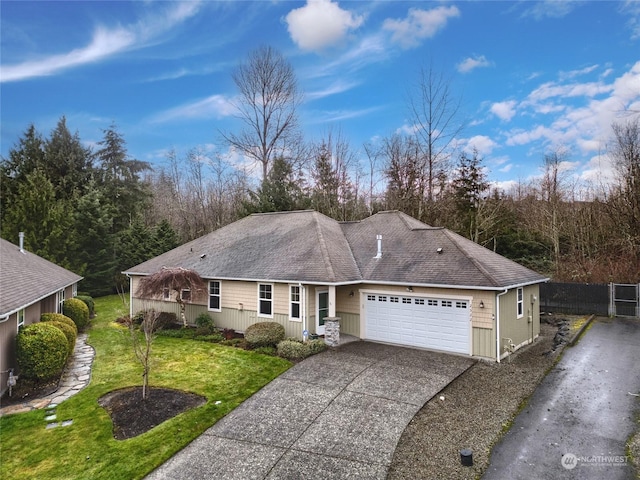 ranch-style home with a garage and a front lawn