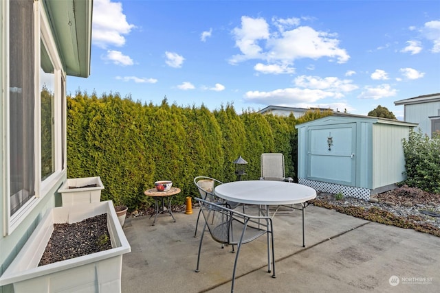 view of patio with a shed