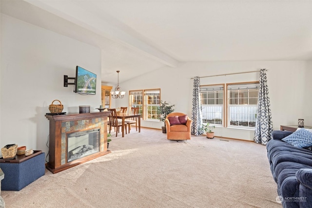 living room with an inviting chandelier, carpet flooring, vaulted ceiling with beams, and a premium fireplace