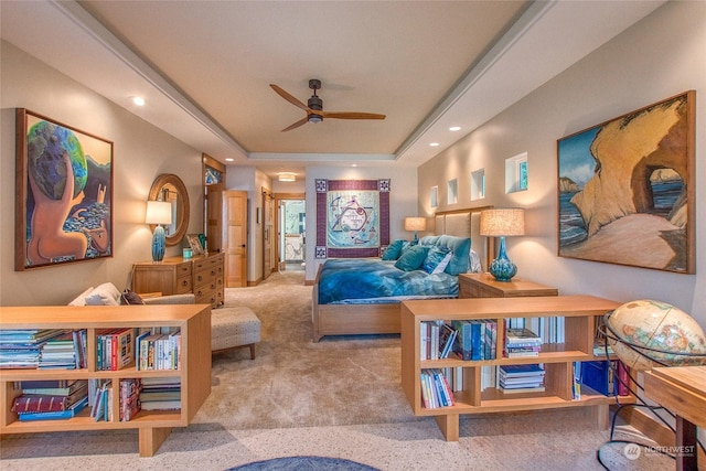 sitting room with a ceiling fan, a raised ceiling, recessed lighting, and carpet