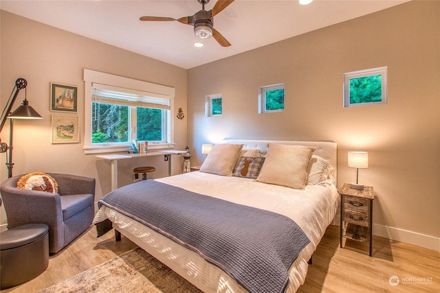 bedroom with a ceiling fan, recessed lighting, baseboards, and light wood finished floors