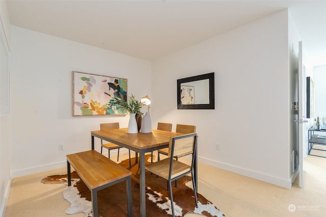 view of carpeted dining space