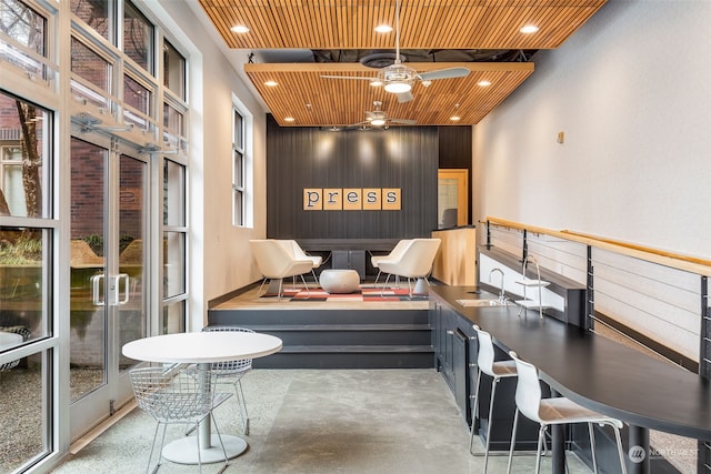 interior space with sink and ceiling fan