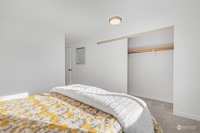 bedroom with carpet flooring and a closet