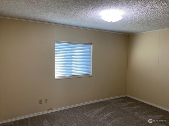 carpeted spare room with ornamental molding and a textured ceiling