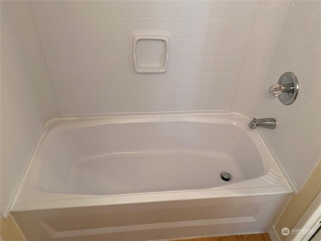 bathroom with hardwood / wood-style floors