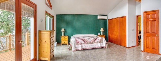 bedroom with lofted ceiling and a wall mounted air conditioner