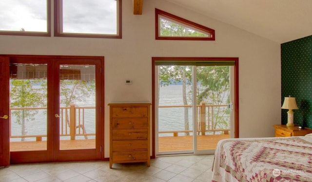 tiled bedroom with a water view, access to exterior, and vaulted ceiling