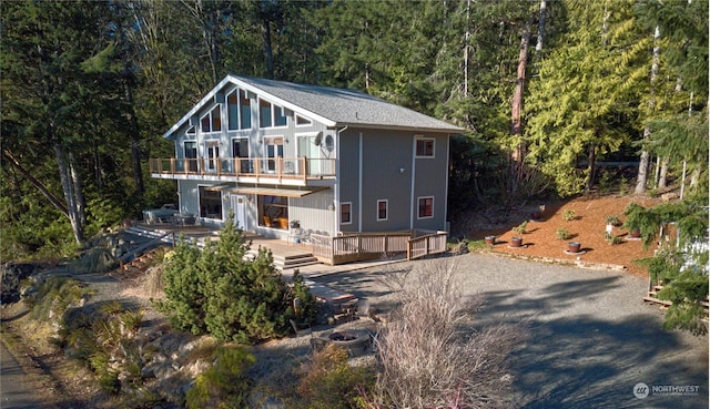 view of front of home featuring a wooden deck and a balcony