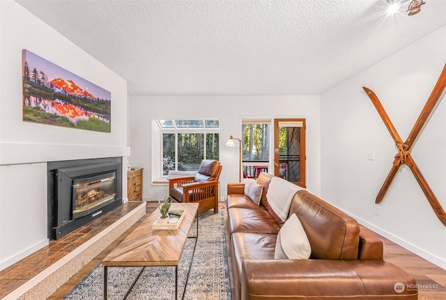 living room featuring hardwood / wood-style floors and a textured ceiling