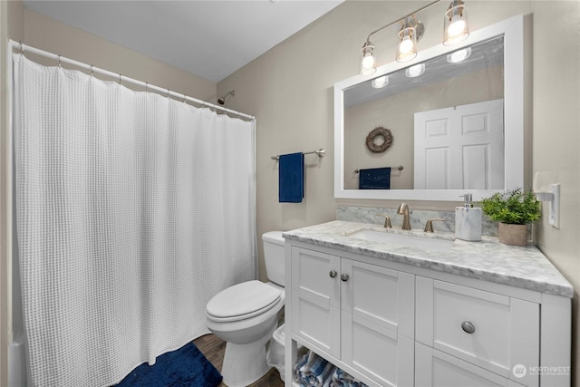 bathroom with vanity, toilet, hardwood / wood-style floors, and a shower with shower curtain