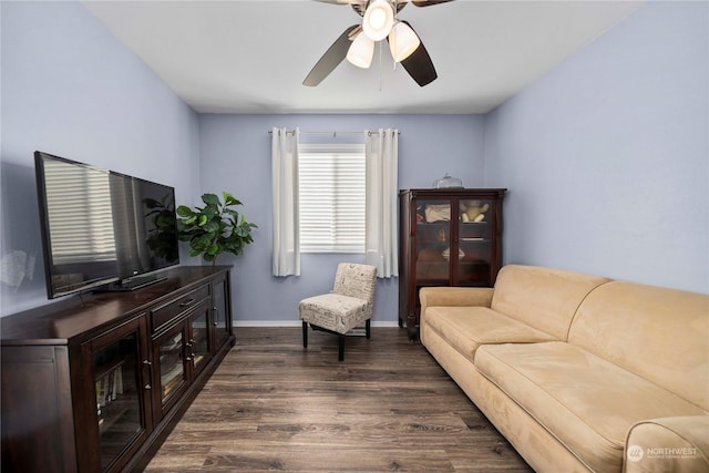 living room with ceiling fan and dark hardwood / wood-style floors