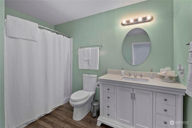 bathroom with vanity, toilet, hardwood / wood-style floors, and a shower with shower curtain