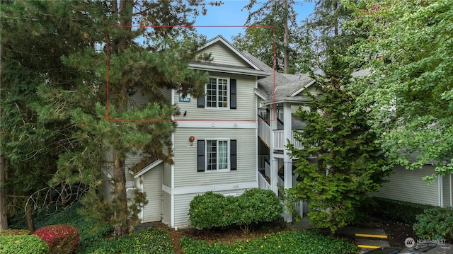 view of side of property with stairs