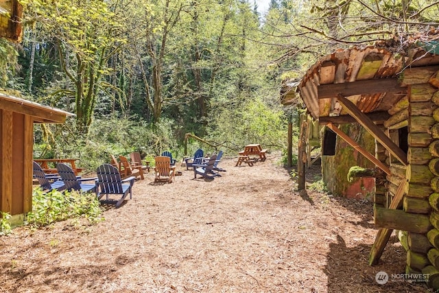 view of yard with a fire pit