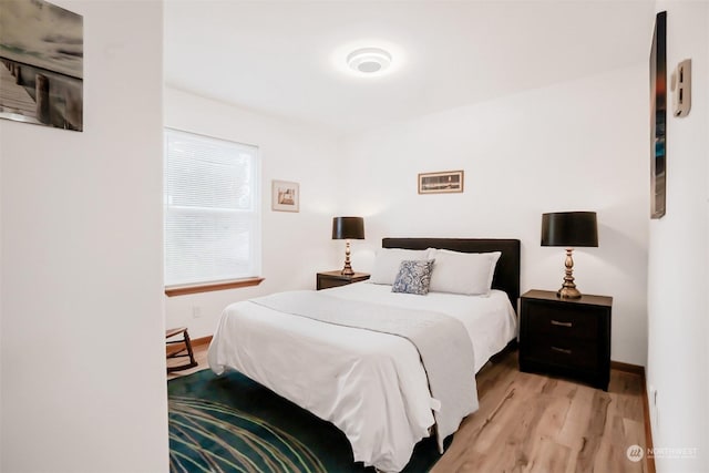 bedroom featuring light wood-type flooring