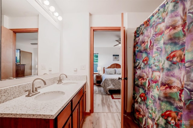 bathroom featuring hardwood / wood-style flooring and vanity