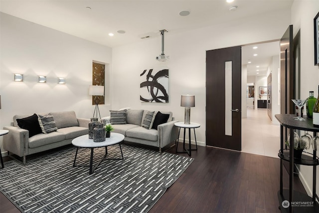 living room featuring visible vents, wood finished floors, and recessed lighting