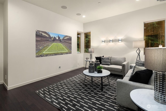 living area featuring recessed lighting, baseboards, and hardwood / wood-style flooring