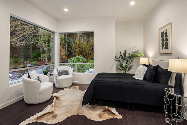 bedroom with recessed lighting, baseboards, and wood finished floors