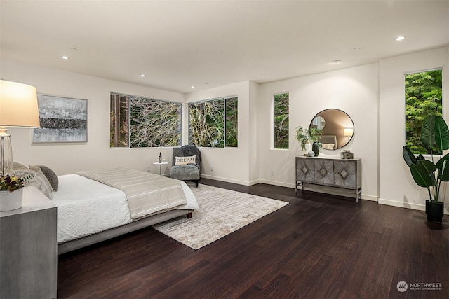 bedroom featuring baseboards, dark wood-style flooring, and recessed lighting
