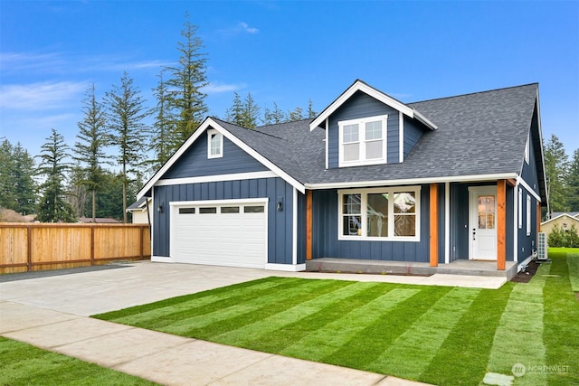 view of front of property featuring a garage and a front yard