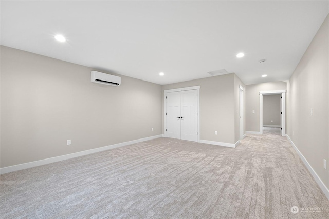 basement featuring light colored carpet and a wall mounted air conditioner