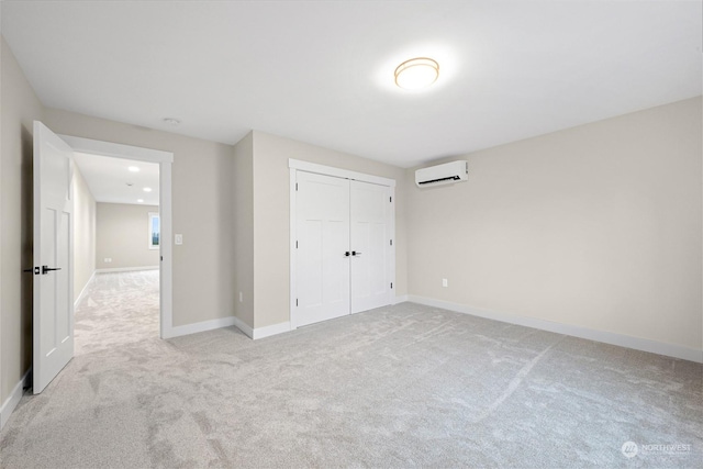 unfurnished bedroom featuring light carpet, a wall mounted air conditioner, and a closet