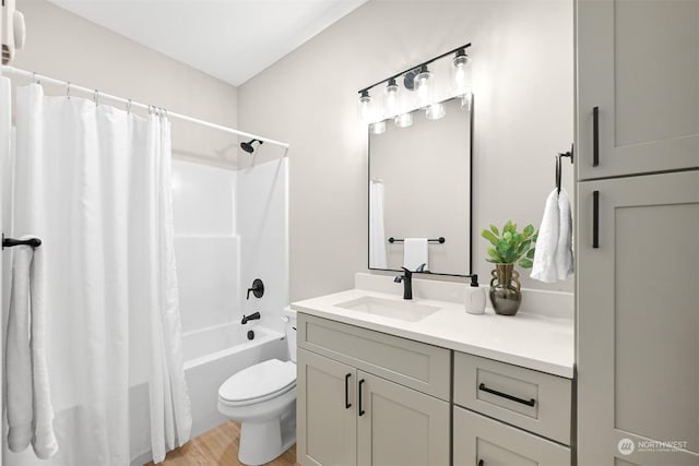 full bathroom with shower / bath combination with curtain, vanity, toilet, and wood-type flooring