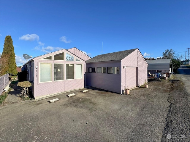 exterior space with a carport