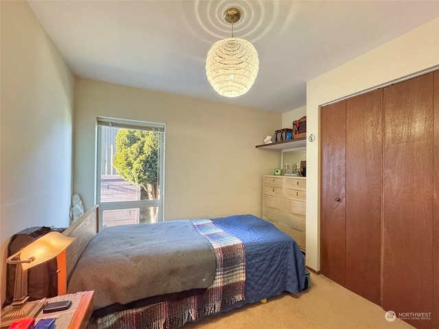 carpeted bedroom with a closet