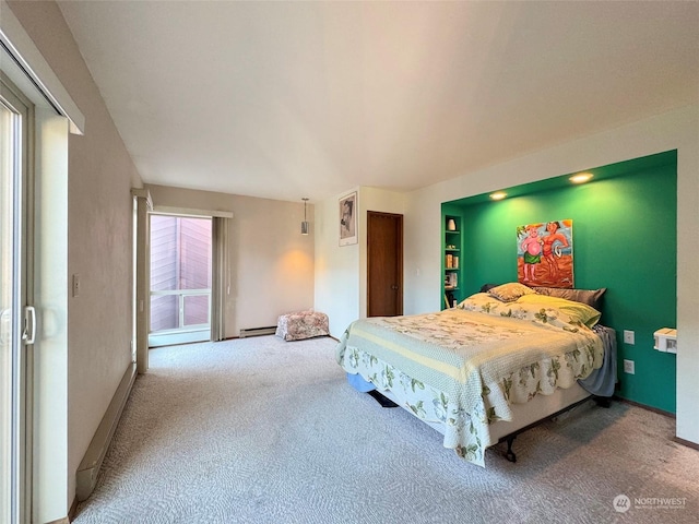 carpeted bedroom featuring baseboard heating