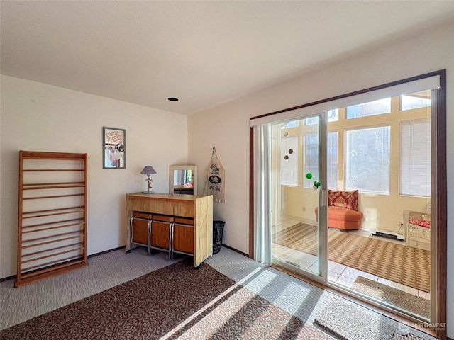 doorway to outside featuring dark colored carpet