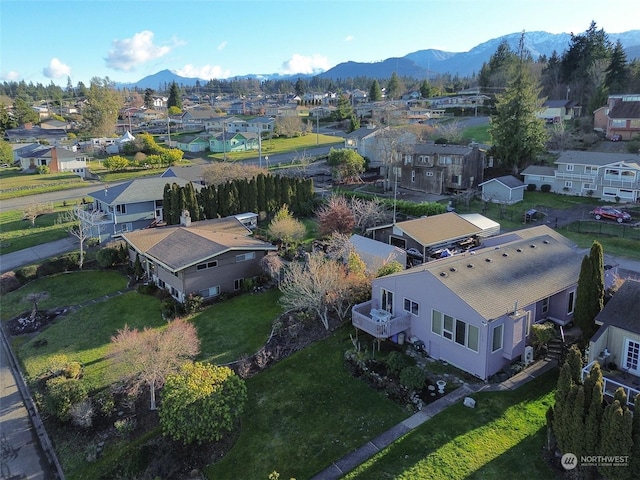 birds eye view of property featuring a mountain view