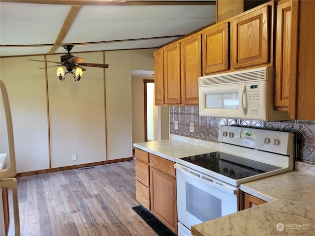 kitchen with white appliances, decorative backsplash, light hardwood / wood-style flooring, and ceiling fan