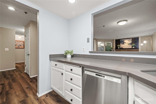 kitchen featuring white cabinetry, dark hardwood / wood-style floors, dishwasher, and a textured ceiling