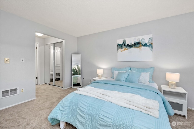 carpeted bedroom featuring a closet