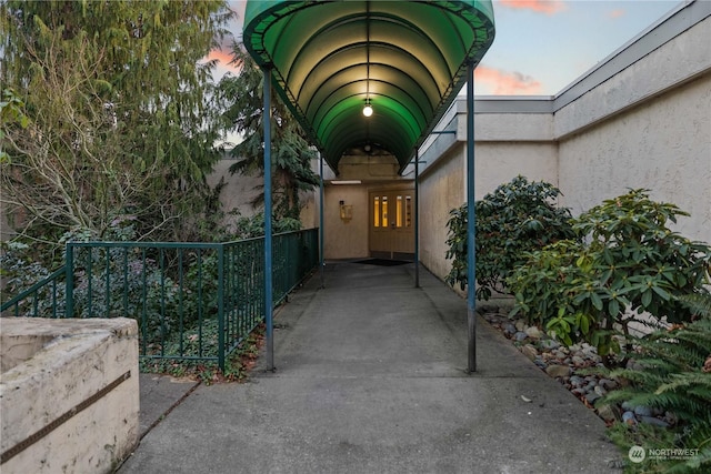 view of exterior entry at dusk