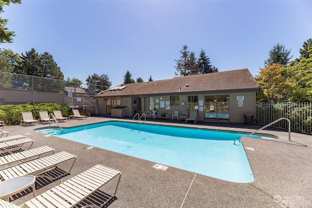 view of swimming pool featuring a patio area