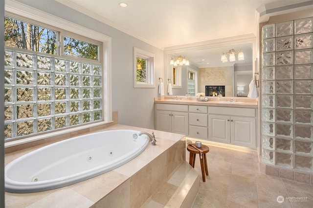 bathroom featuring ornamental molding, a relaxing tiled tub, a high end fireplace, and vanity