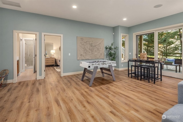 recreation room with light hardwood / wood-style floors