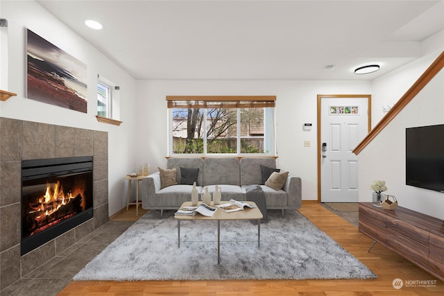 living room with hardwood / wood-style floors and a fireplace