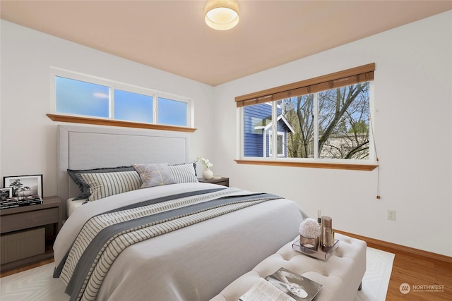 bedroom with hardwood / wood-style flooring