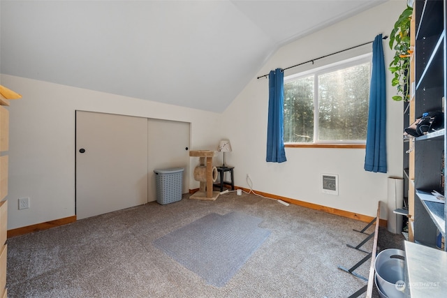 bonus room featuring lofted ceiling and carpet floors