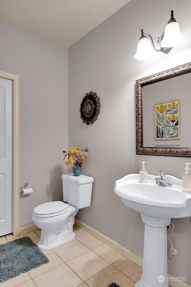 bathroom featuring tile patterned floors and toilet