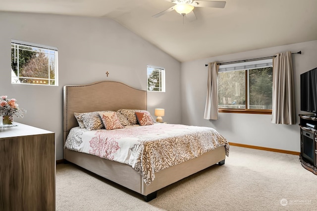 carpeted bedroom with vaulted ceiling and ceiling fan