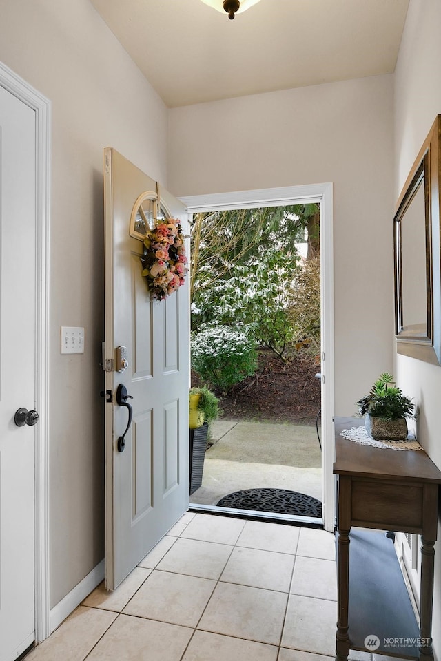 entryway featuring light tile patterned floors